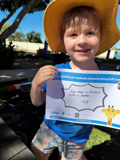 Kindergarten student Sully King displays a message during Harold's Kindness Week activities. Picture supplied