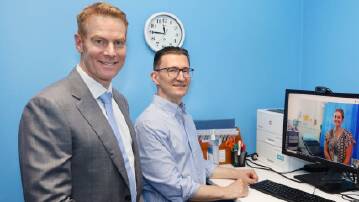 Dr Chris Bell and physiotherapist Stuart McCaskill. Orthopaedic outpatients in Mount Isa can now access virtual support via a new telehealth partnership with the QEII Hospital. Picture Qld Health