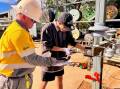 A student has a go on the tools at Ergon Energy's Mount Isa depot. Picture Ergon Energy