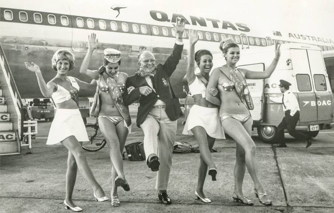 Sir Bruce Small travelling in the 1960s as Mr Gold Coast with bikini models to
promote Surfers Paradise tourism. Picture supplied