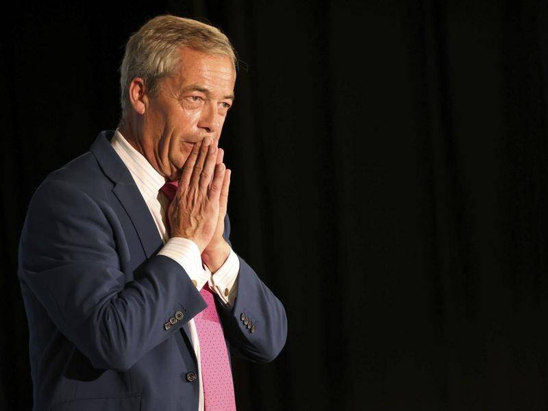 Reform UK's Nigel Farage told a campaign event 'one or two people let us down and we let them go'. (AP PHOTO)