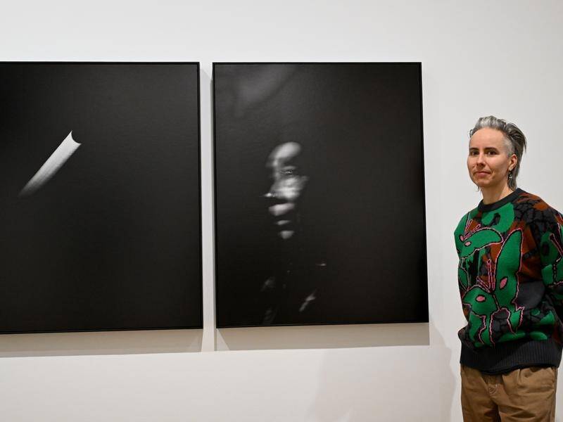 Amos Gebhardt has won the National Photographic Portrait Prize for the work Alexis with moon. (Lukas Coch/AAP PHOTOS)