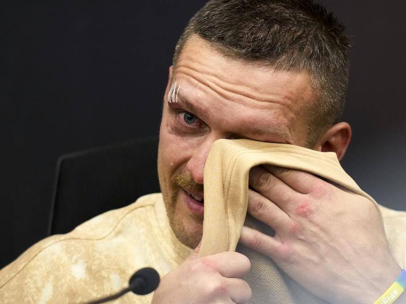 Ukraine's Oleksandr Usyk cries as he talks about his father following his win over Tyson Fury. (AP PHOTO)
