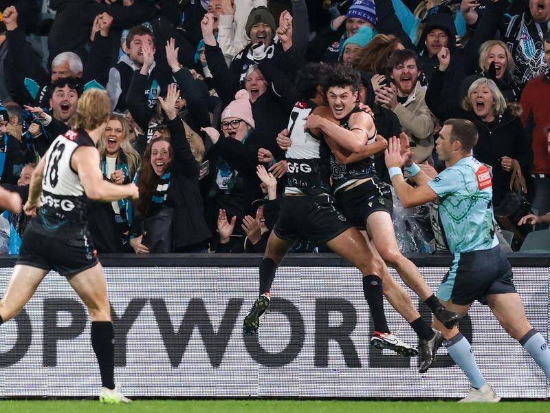 Darcy Byrne-Jones (R) wants Port to move on from his dramatic match-winning goal against Hawthorn. (Matt Turner/AAP PHOTOS)