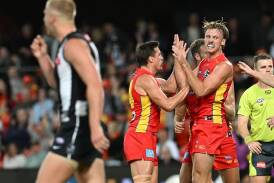 Damien Hardwick's rapidly maturing Gold Coast are winning admiring glances from rivals. (Dave Hunt/AAP PHOTOS)